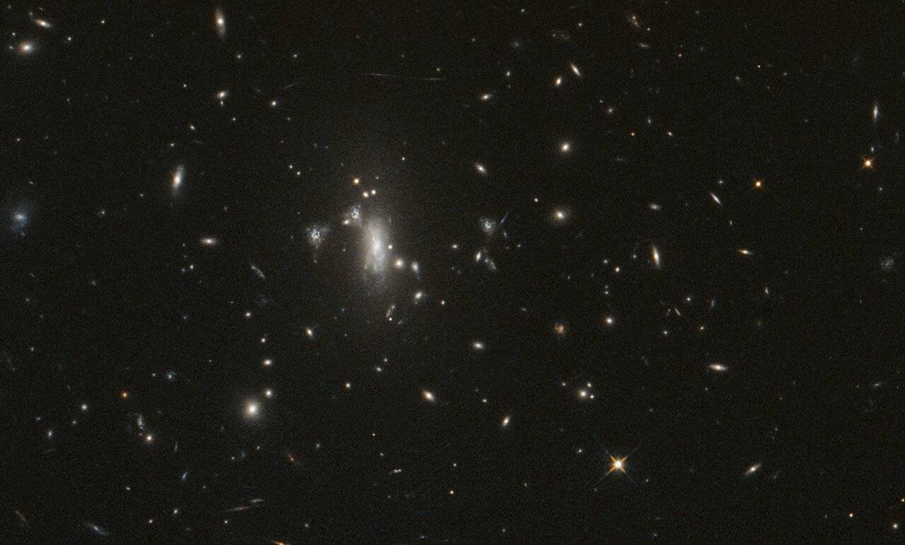 Hubble seeks lensed supernova, marks 200,000 orbits