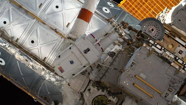 NASA astronaut Chris Williams works outside the International Space Station during a spacewalk