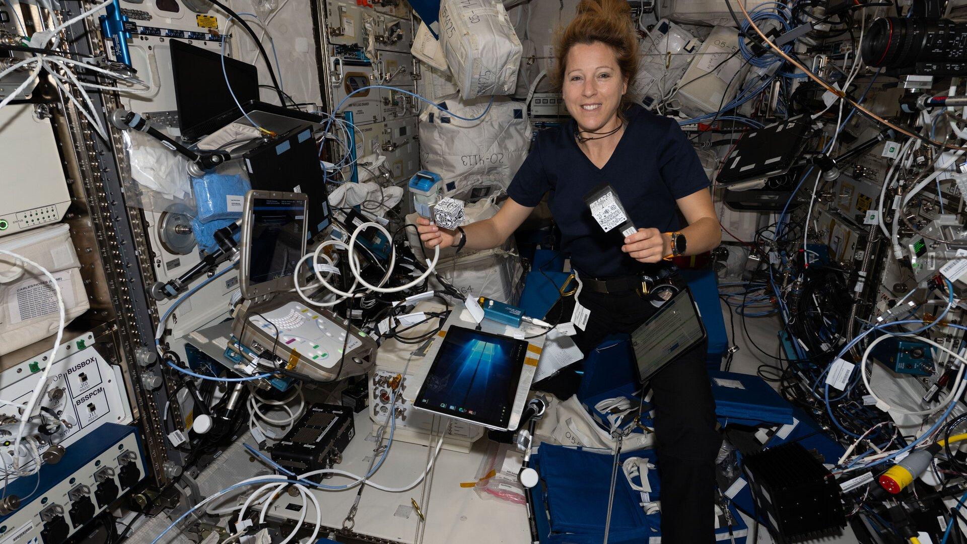 Sophie Adenot, inside the International Space Station's European Columbus module, prepares an autonomous ultrasound session for the EchoFinder experiment.