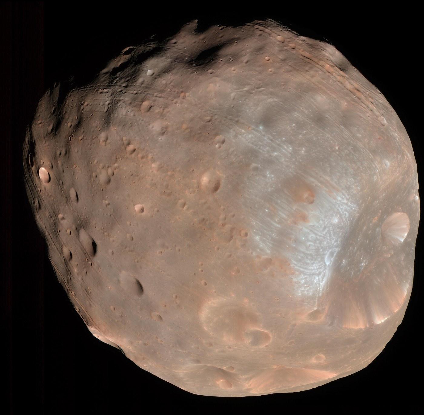 Phobos seen by the HiRISE camera on Mars Reconnaissance Orbiter: a dark, irregular, heavily cratered body, with the large Stickney crater taking up much of the disc.