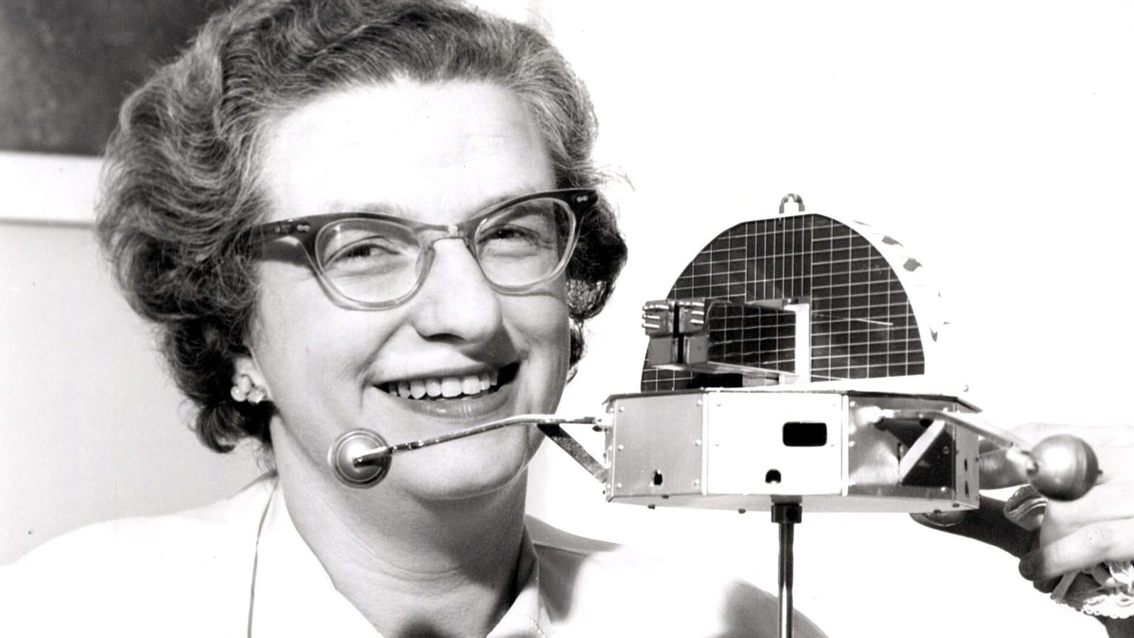 Nancy Grace Roman, NASA's first chief of astronomy, poses in 1962 next to a model of the Orbiting Solar Observatory satellite.